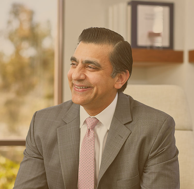 A man smiling in an office.