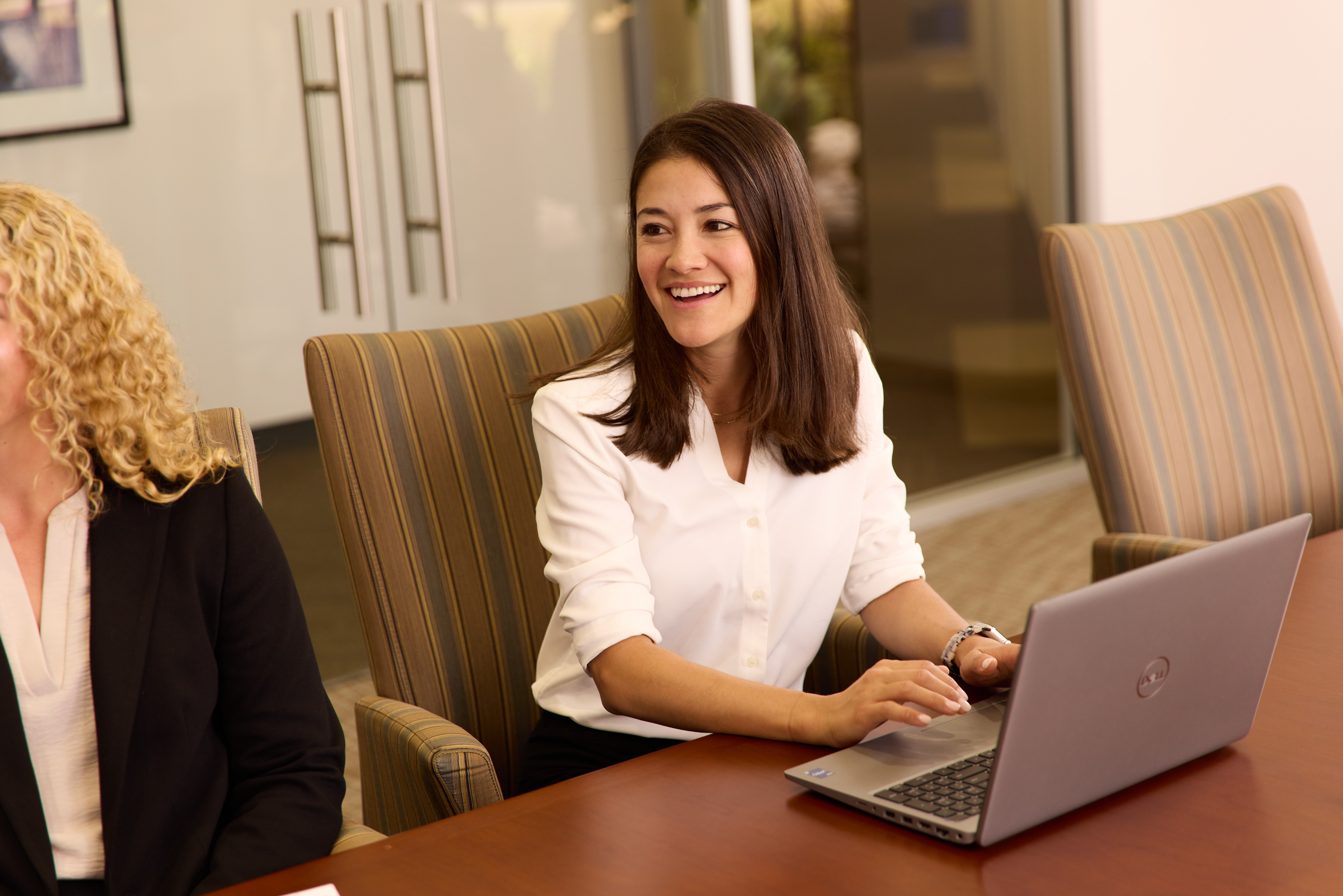 Two colleagues at a table talking