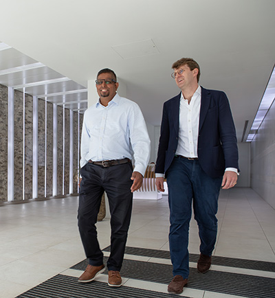 two employees walking.