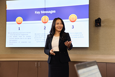 A woman presents to a group