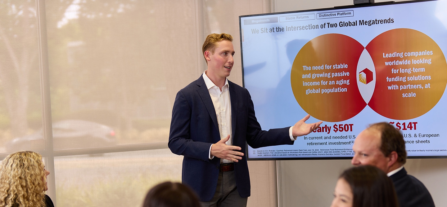 Man delivering presentation to colleagues