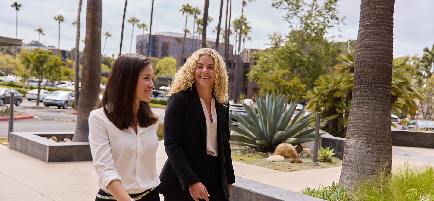 two people walking to an office building