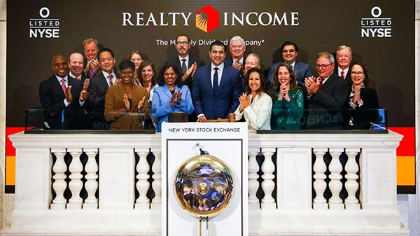 Group of people standing at the NYSE after opening bell
