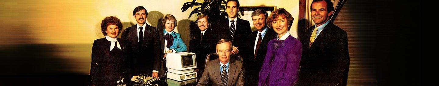People standing around a desk